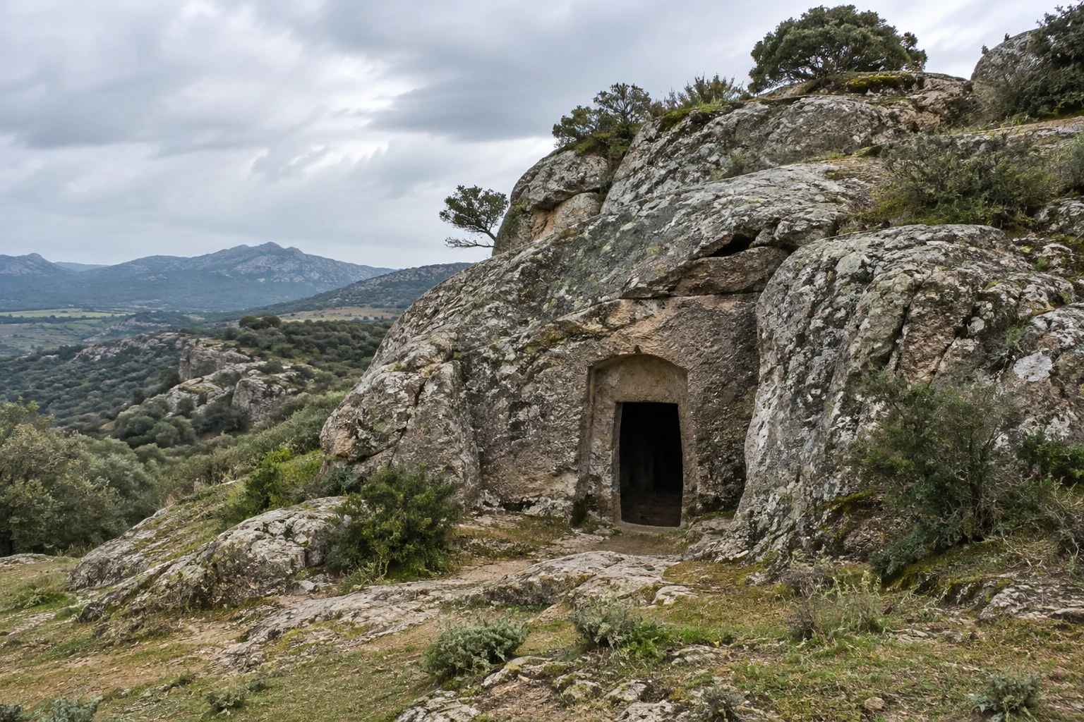 Small doorway cut into a weathered rocky hillside.